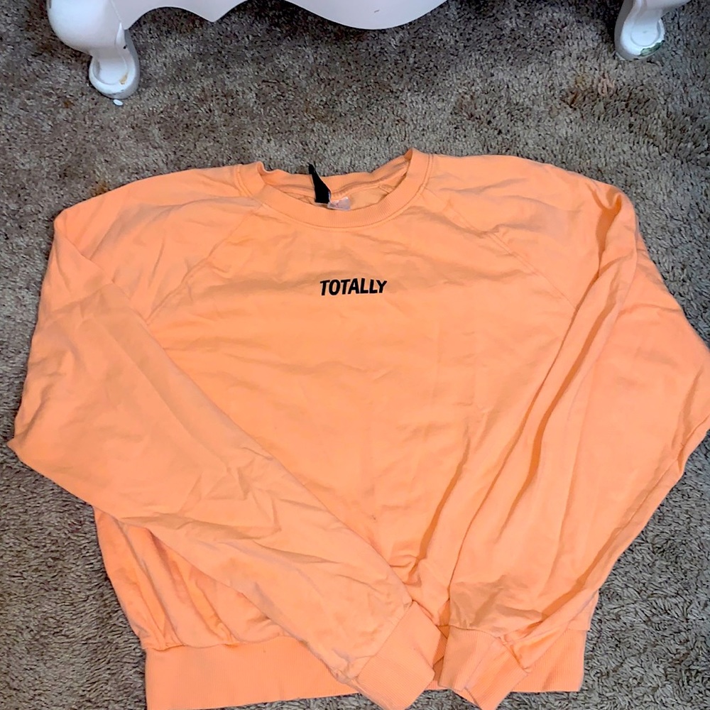 This is a light orange crew neck hoodie very comfy